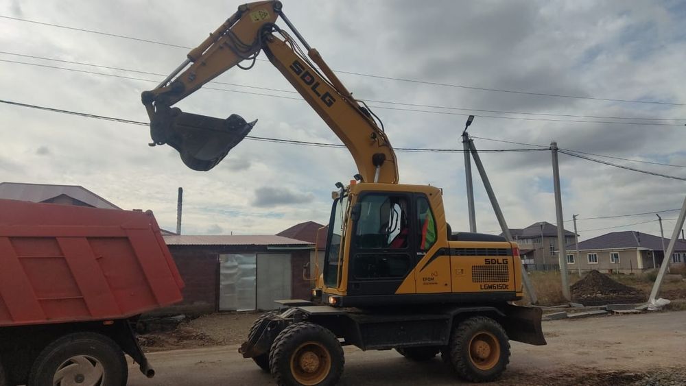 Услуги колесного экскаватора