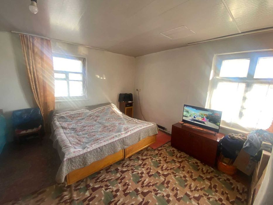 Дом на Бугре, Танат Империя