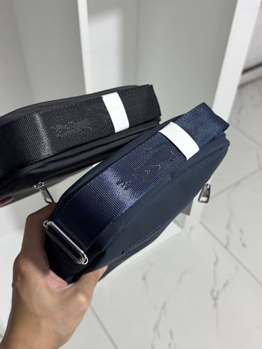 Барсетки Lacoste в черным и синем цвете
