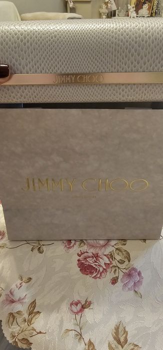Продавам използвани слънчеви очила Jimmy Choo с чанта и калъф