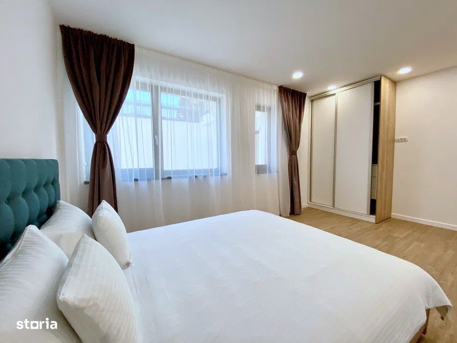 Apartament 2 camere cu parcare și terasă cu servicii hoteliere — fotografia 1