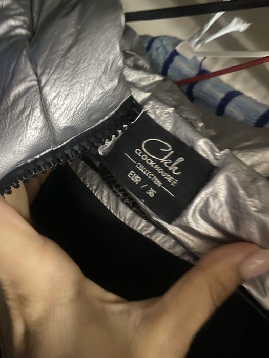 Пуховик стального цвета