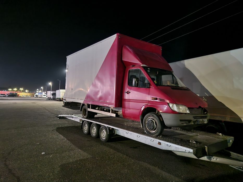 Tractari auto transport Romania Spania pe platforma dube utilaje