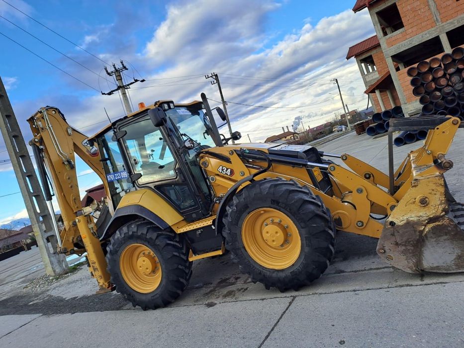 Inchiriere  buldoexcavator Caterpillar 434 roti egale