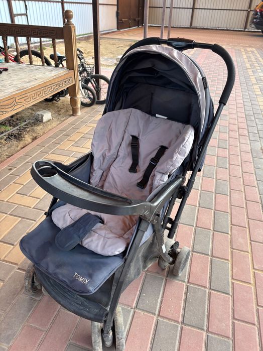 Продам прогулочную коляску Tomix