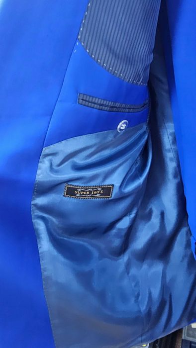 костюм новый голубой