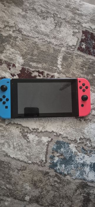 Consolă Nintendo Switch Neon Red/Blue + Dock + 2 Jocuri Fizice