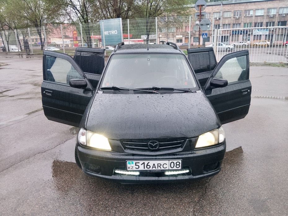 Мазда демио 2003 года