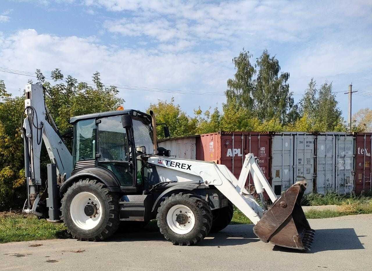Экскаватор погрузчик траншея