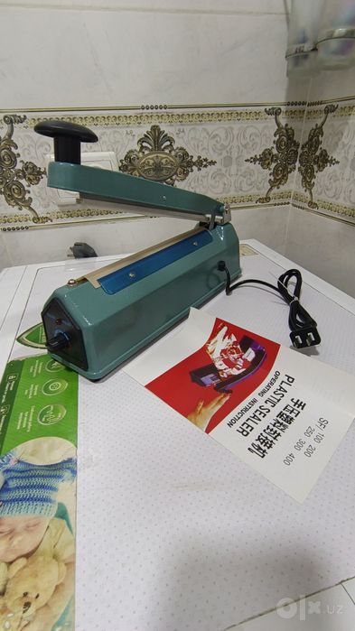 Paket yopishtirish apparati
