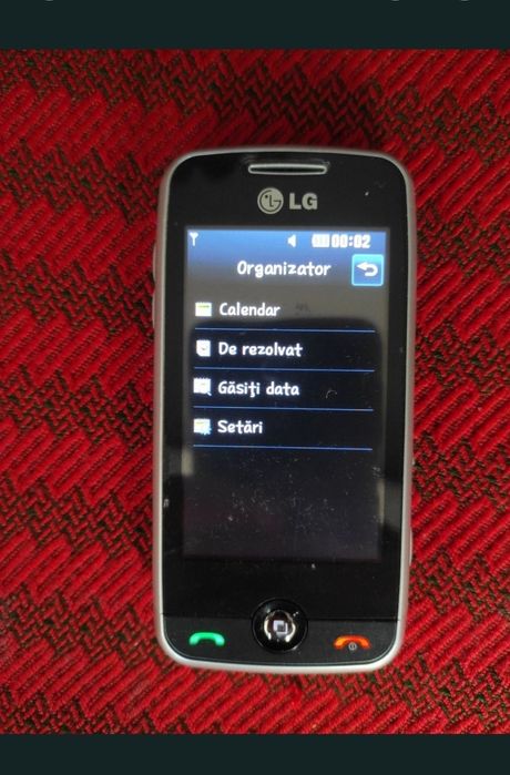 Telefon cu touchscreen și camera video/foto, cu carcasă de aluminiu
