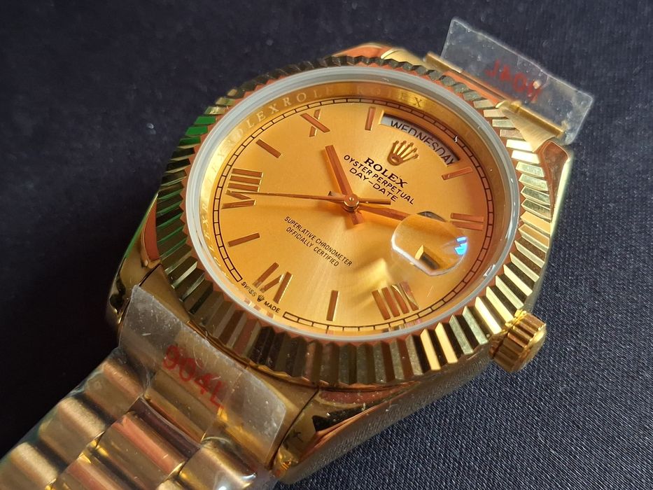 Rolex  Submariner, Day-Date Gold
