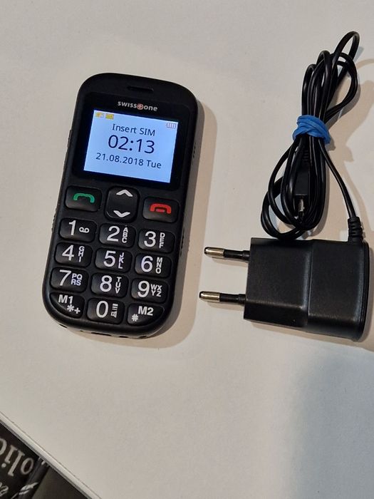 Telefon cu butoane cu încărcător