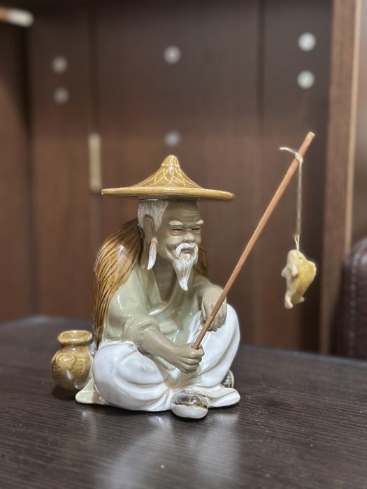 bibelou chinezesc cu undita si peste