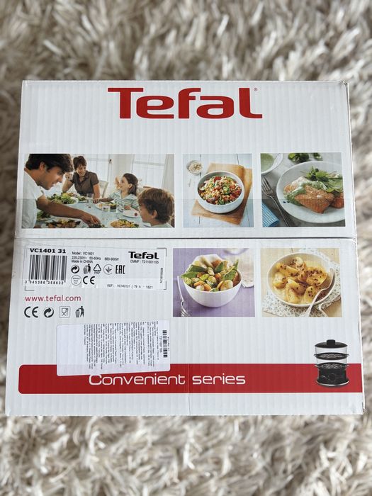 Este nou Aparat de gatit cu aburi Tefal VC1401, 900W, Timer, oprire automata, depozitare compacta, grile detasabile,