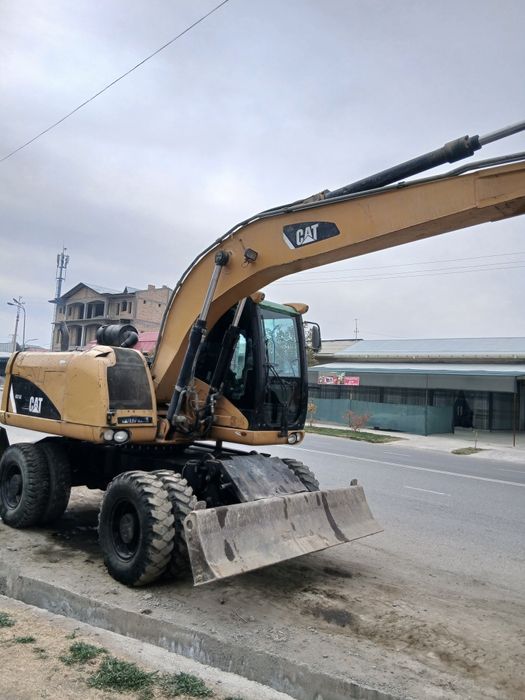 CAT M313D экскаватор сотилади