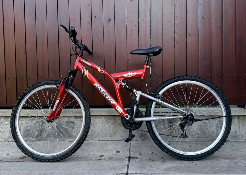 Bicicletă copii MTB Kreativ Dinamik 24", 18 viteze, dublă suspensie – stare bună