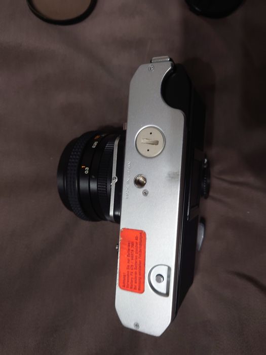 SLR Konica Autoreflex T3 (N} cu obv Hexar AR 28mm