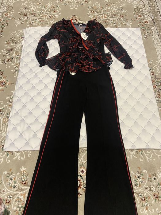 Новый костюм 38 р