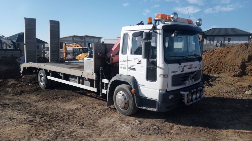 Ofer transport vehicule/utilaje/materiale pe platforma,pret negociabil