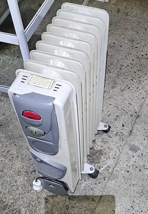 Напольный масляный радиатор ТЕПЛОЛЮКС 9 Секций