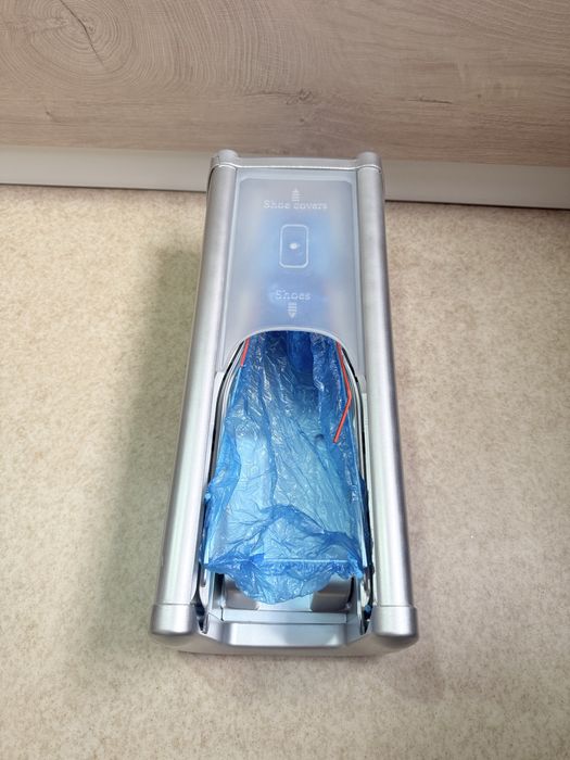 Dispenser papucei de unica folosinta