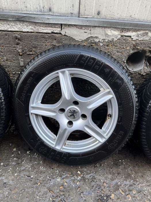 Jante gama Peugeot 185/65/15 cu anvelope de iarna
