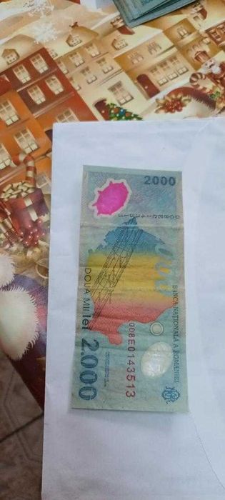 Vând bancnote de 2000 lei, cu eclipsa totală de soare din 1999.