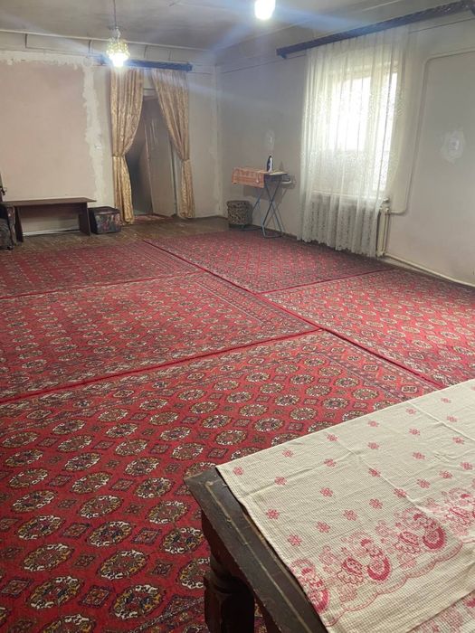 Двухэтажный дом с пристройкой