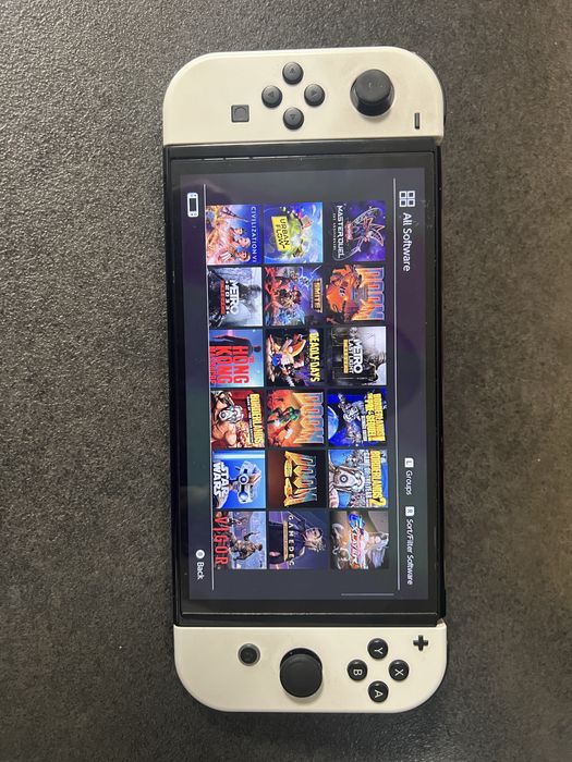 Nintendo Switch OLED + 20 игри+ НОВИ Joy-Con + акаунт + Hard Case