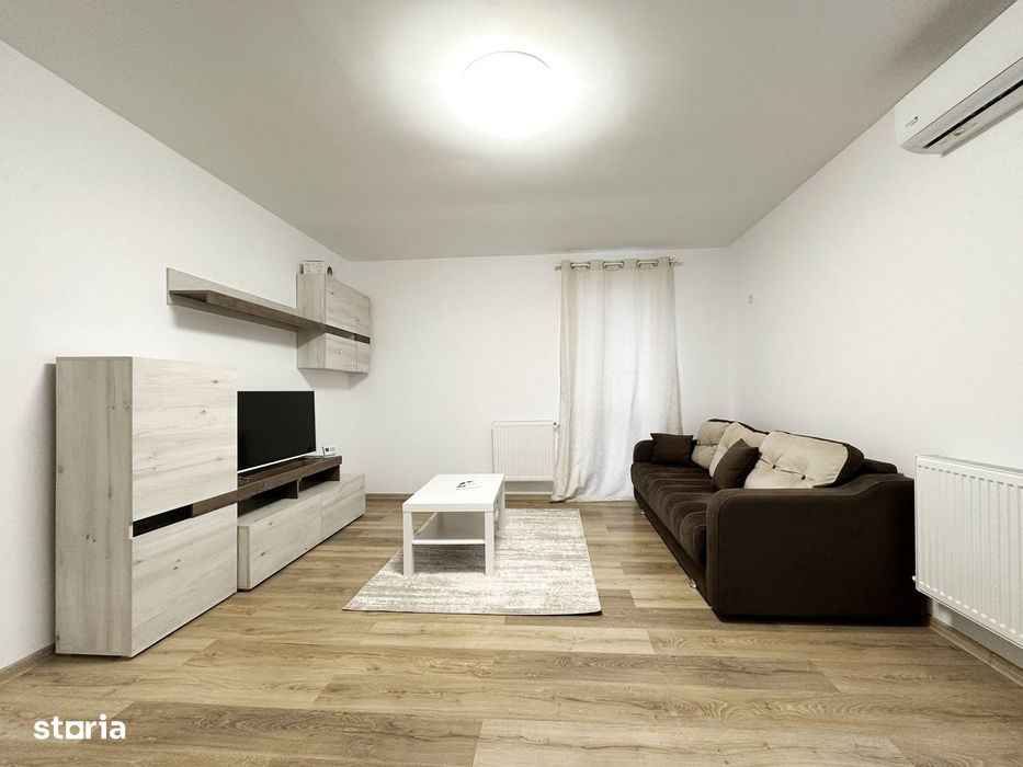 Apartament intr-un bloc retras, cu centrala si parcare — fotografia 1