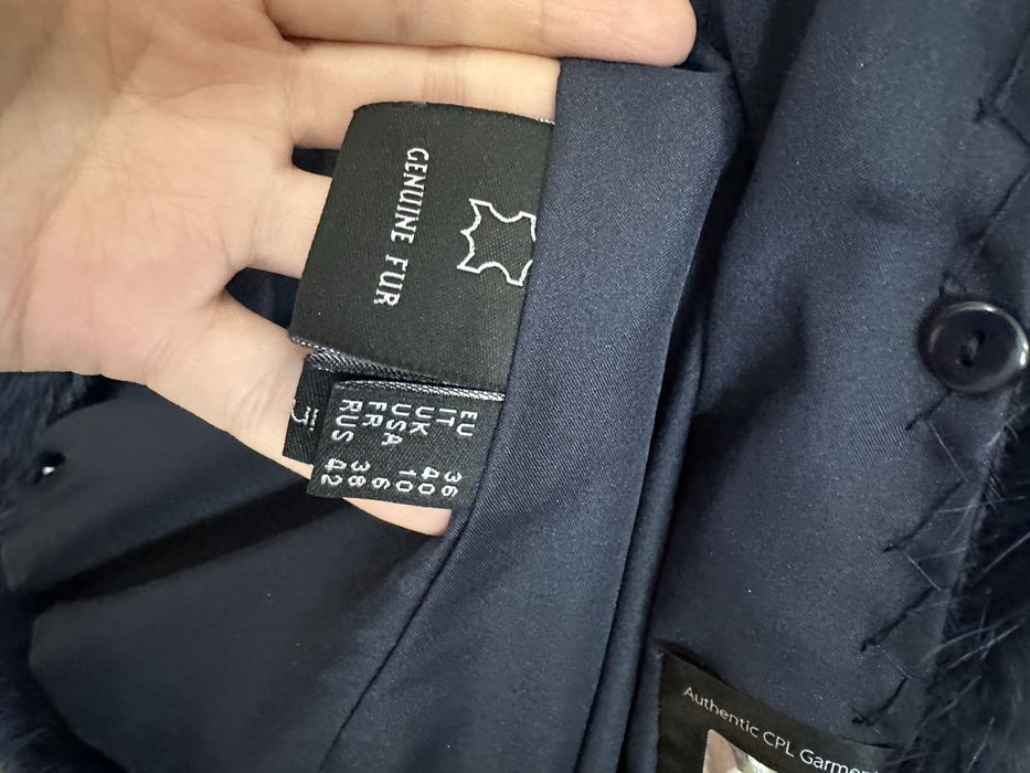 Продам меховой жилет (енот)