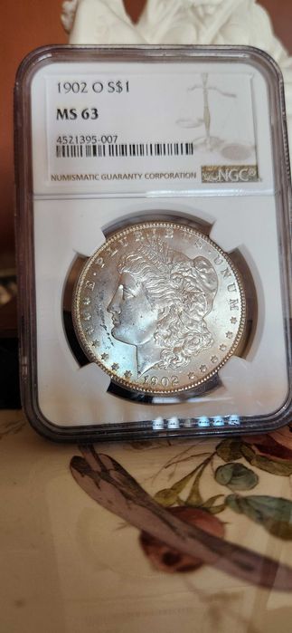 Monedă Morgan Dollar 1902 O – Argint – NGC MS63 – New Orleans Mint