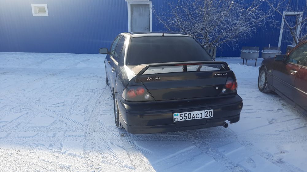 митсубиси лансер 2002