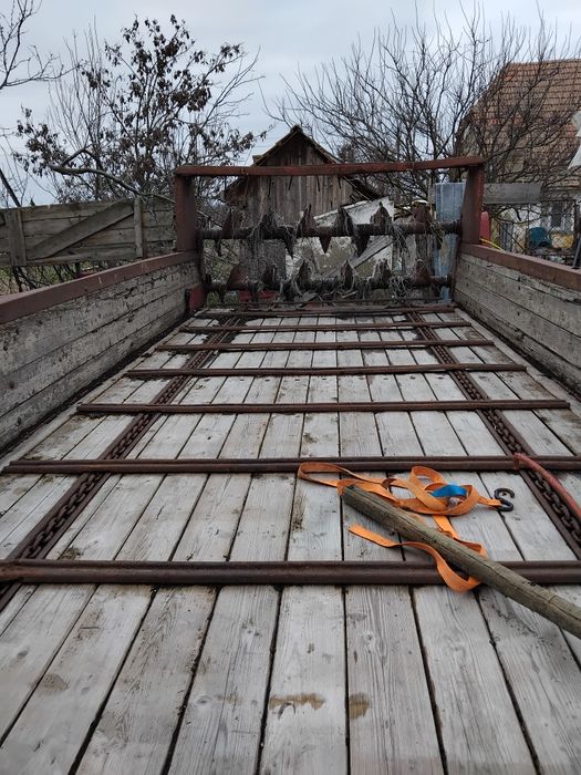 Remorca de împrăștiat gunoiul ,Krone