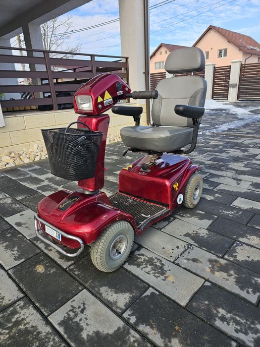 Scuter electric carut scaun persoana cu dizabilitati  Rascal