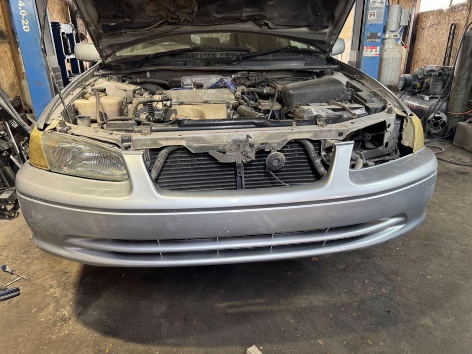 Передний бампер Camry 25