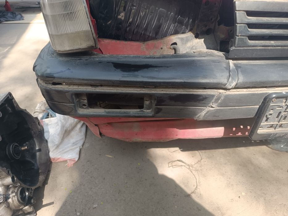 Передний бампер Mazda 323 BF