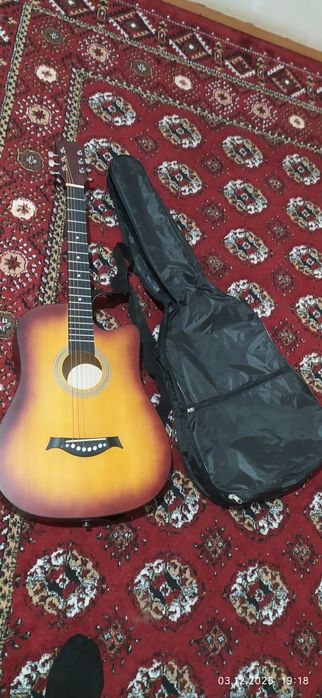 Гитара сотилоди тозо