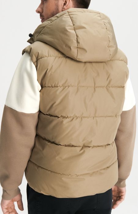 Капитониран елек