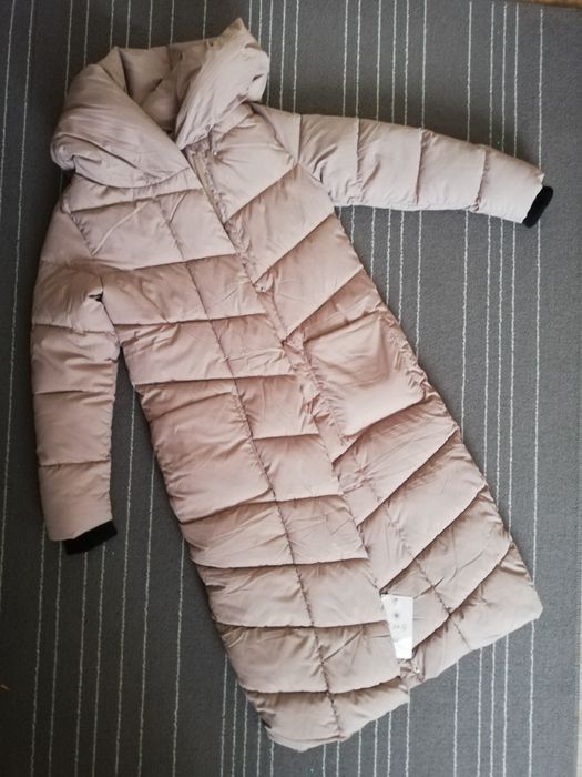 Продам новый женский  пуховик