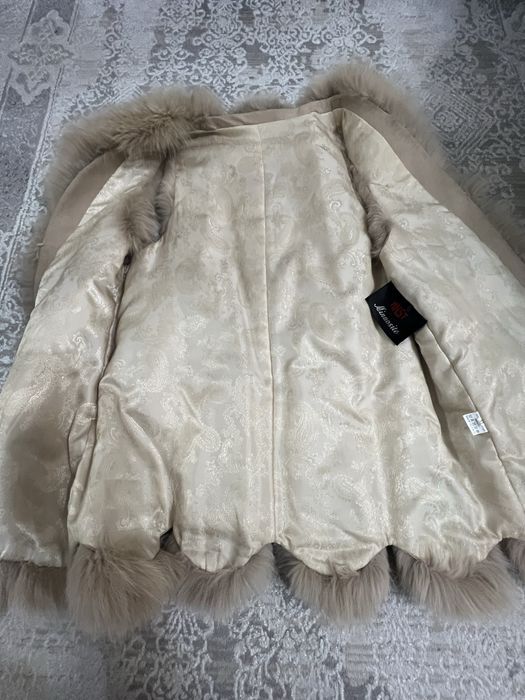 Продам меховую жилетку