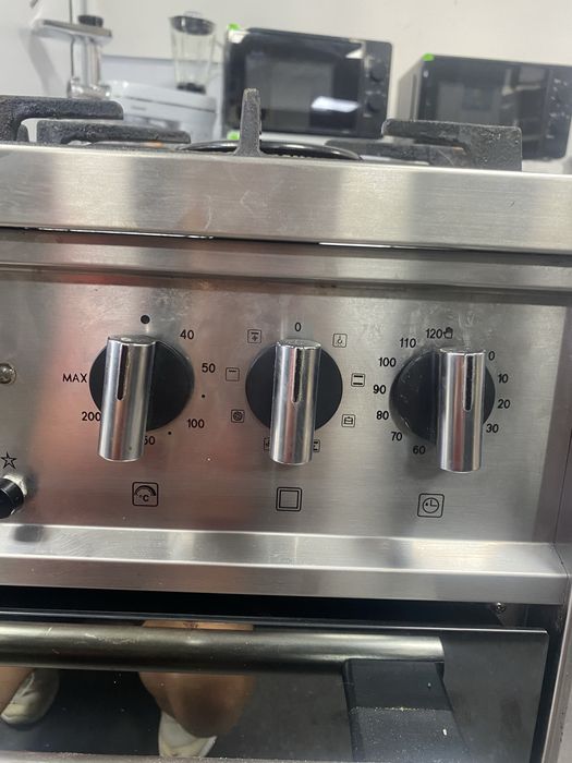 Комбинирана готварска печка на газ и ток Indesit KPST72S/DK
