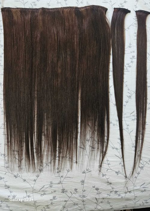 Натуральные волосы прошиты в тресс.