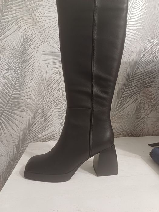 Продам новые сапоги