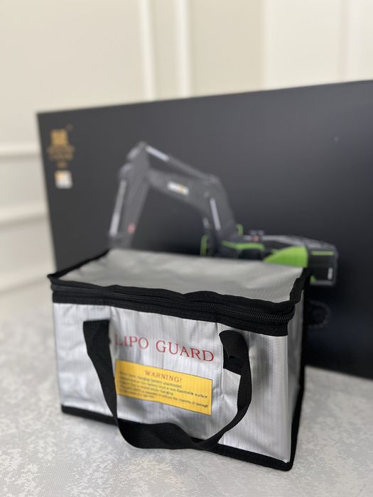 Игрушка радиоуправляемый экскаватор