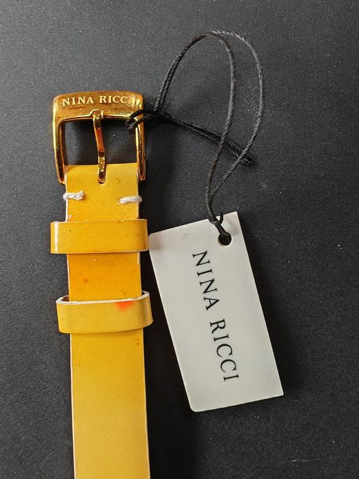 Ceas de dama Nina Ricci  auriu cu cadran alb original, nou  fără cutie