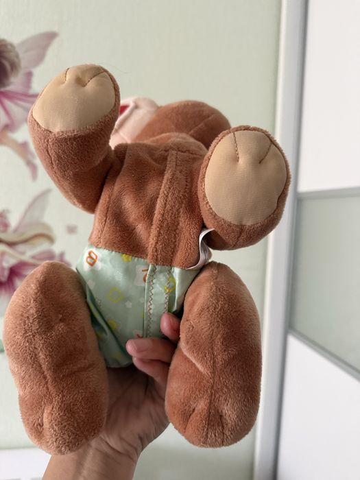 Продам игрушку ползающий мишка