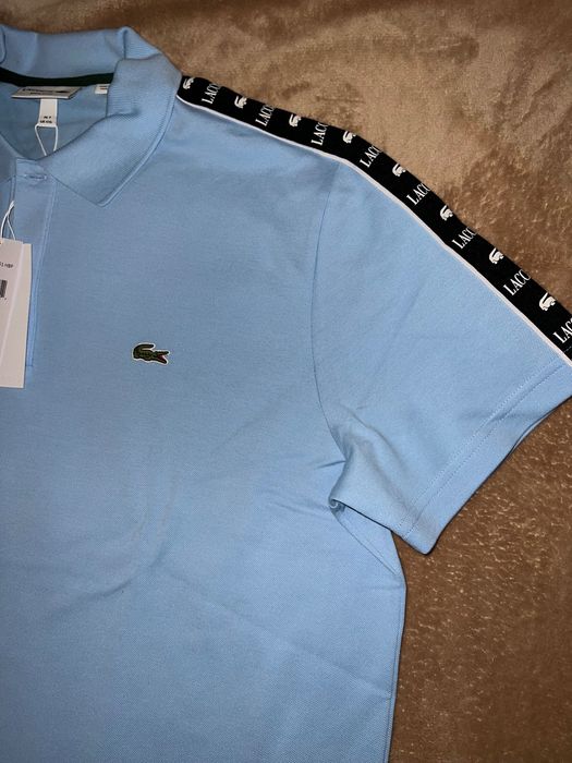 Поло Lacoste небесно-голубого цвета с лампасами, размер XXL.