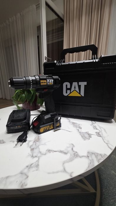 Mașină de găurit și înșurubat cu percuție CAT DX18V (DX155) + Akku + Accesorii – Nouă
